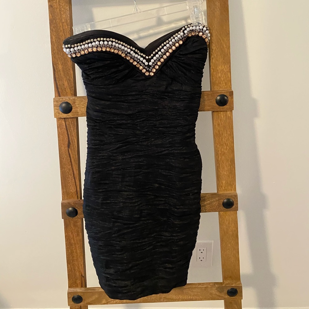 Black mini dress with jewels on chest size 1